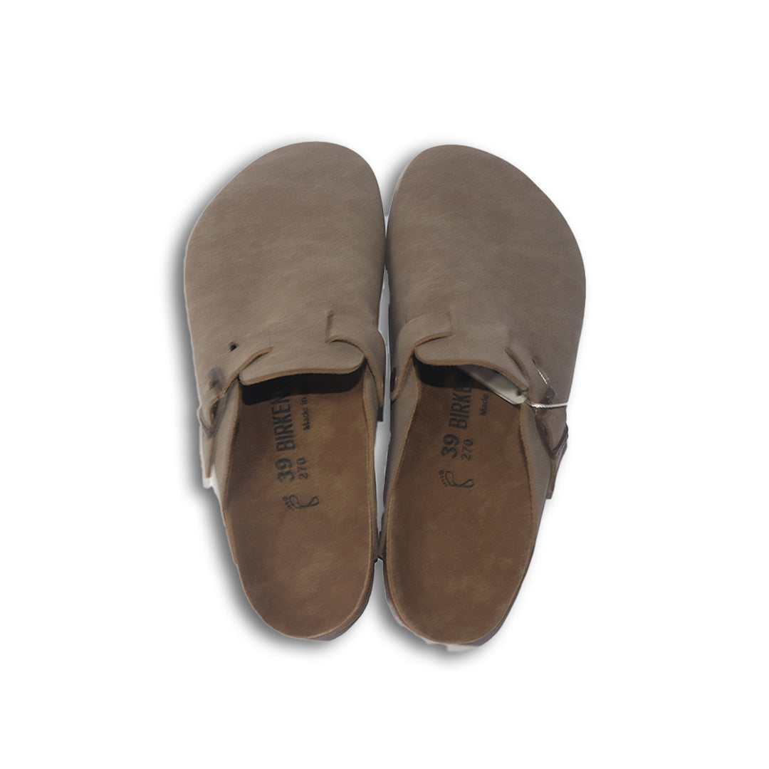 Pair of brown birkenstock slippers on a white background