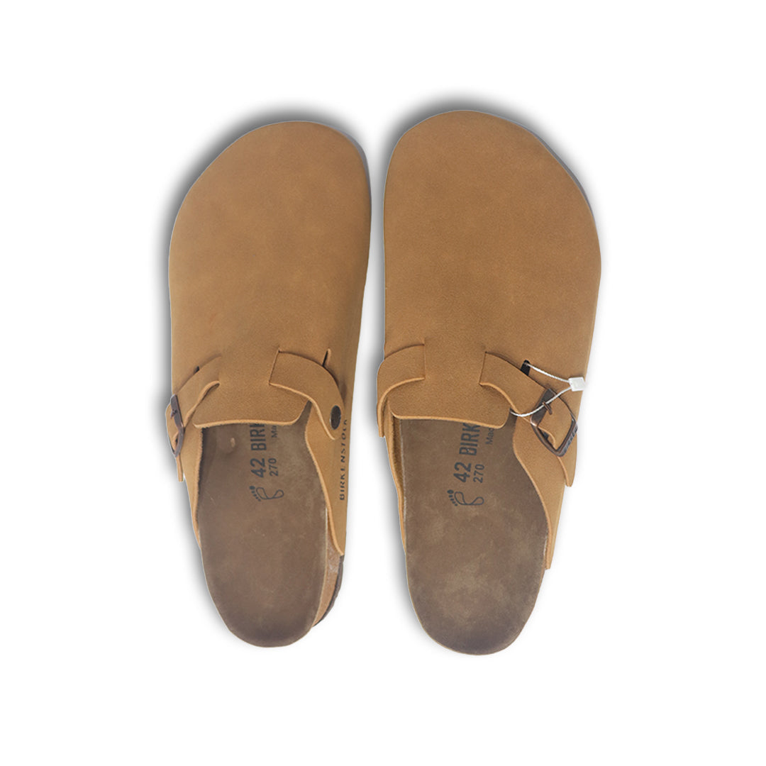 Pair of tan Birkenstock sandals with a buckle on a white background